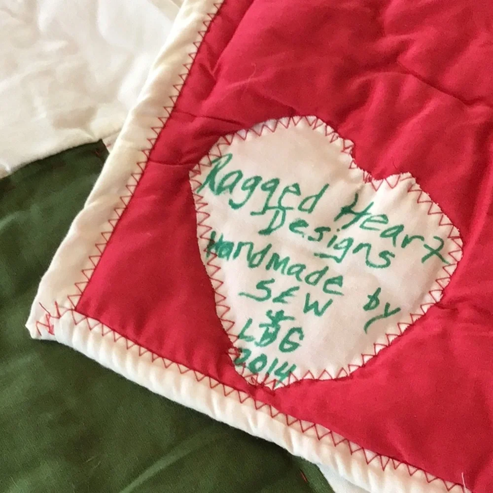 Handmade Christmas-themed applique quilt